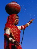 Performer Dancing with Water Pot at Holi Festivities, Jaipur, India Photographic Print by Paul Beinssen