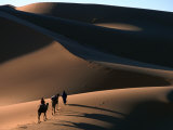 Camel Caravan Crossing the Erg Chebbi Dunes of Merzouga, Erg Chebbi Desert, Morocco Photographic Print by John Elk III