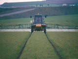 Spraying Pesticides on Crops in Fields, Cambridgeshire, England, United Kingdom Photographic Print by David Lomax