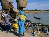 Women with Baskets of Laundry on Their Heads Beside the River, Djenne, Mali, Africa Photographic Print by Bruno Morandi