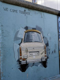 A Trabant Car Painted on a Section of the Berlin Wall Near Potsdamer Platz, Mitte, Berlin, Germany Photographic Print by Richard Nebesky