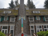 Child Checking Level of Rain Gauge at Lake Quinault Lodge, Washington State, USA Photographic Print by Aaron McCoy