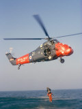 Wessex Helicopter Winching up Survivior in Rescue from Sea Photographic Print by R H Productions 