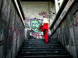Woman Climbing Graffiti Stairwell, Belgrade, Serbia Photographic Print by Doug McKinlay