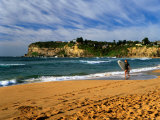 Surfer on Avalon Beach, Bilgola Headland in Background, Sydney, New South Wales, Australia Photographic Print by Ross Barnett