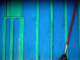 Red Broom Stands Out against a Wall in Pital, Campeche, Mexico Photographic Print by Jeffrey Becom