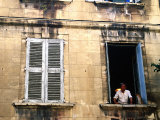 Man with Cat in Window, Avignon, Provence-Alpes-Cote d'Azur, France Photographic Print by Glenn Van Der Knijff