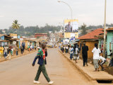 Man Crossing Road and People on Footpath, Kigali, Rwanda Photographic Print by Ariadne Van Zandbergen