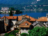 Village Roofs with Lago d'Orta and Isola San Giulio in Background, Orta San Giulio, Piedmont, Italy Photographic Print by Glenn Van Der Knijff