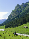Man on Horse at Altyn-Arashan Near Kara-Kol, Kyrgystan, Central Asia Photographic Print by Upperhall Ltd