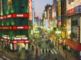 Busy Streets and Neon Signs in the Evening at Shinjuku Station, Shinjuku, Tokyo, Japan, Asia Photographic Print by Chris Kober