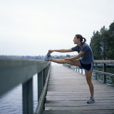 Young Woman Prepares for Jogging Photographic Print by Aaron McCoy