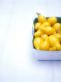 Pear-shaped Yellow Tomatoes in a Cardboard Box Photographic Print by David Loftus