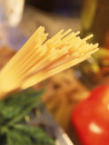 Dry Pasta, Grater, Tomato, and Herbs Photographic Print by Eric Kamp