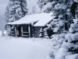 Snow Covered Log Cabin in Woods Photographic Print by Mick Roessler