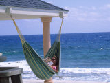 Woman Reading on a Hammock, Cayman Photographic Print by Barry Winiker
