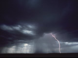 Shot of a Thunderstorm with an Arc of Lightning at Right Photographic Print by Kenneth Garrett