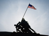 The Iwo Jima Memorial Silhouetted with Flag Flying Photographic Print by Stephen St. John
