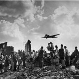 US C-47 Cargo Plane Flying over Ruins, Approaching Tempelhof Airport with Food and Supplies Photographic Print by Walter Sanders
