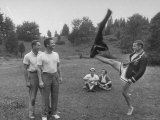 Kelso Davis Kicking Off Trousers For Phil Stearns and Max Berking at College Reunion Photographic Print by Lisa Larsen