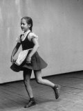 Little Girl Holding the Fringe of Her Skirt While Dancing Across the Floor Photographic Print by Lisa Larsen