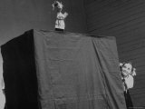Little Girl Enjoying a Puppet Show of Petrouchka Photographic Print by Lisa Larsen