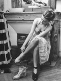 Model Changing Her Shoes For Pierre Balmain's Fashion Show Photographic Print by Nina Leen