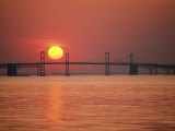 View from the Water of the Chesapeake Bay Bridge and the Setting Sun Photographic Print by Kenneth Garrett