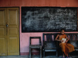Young Monk Reading in Classroom, Chiang Mai, Thailand Photographic Print by Bill Wassman