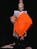Standing Buddha Statue in Orange Cloth, in Outer Gallery at Angkor Wat, Angkor, Cambodia Photographic Print by Tom Cockrem