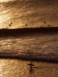 Surfers Riding Waves on the Bukit Badung Peninsula, Bali, Indonesia Photographic Print by Alain Evrard