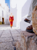 Woman Approaching Man Sitting on Step in Lane, Nerja, Spain Photographic Print by Philip & Karen Smith