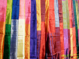 Colorful Silk Scarves at Edfu Market, Egypt Photographic Print by Michele Molinari