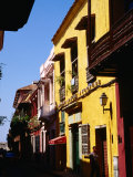 Colonial Facades in Street, Cartagena, Colombia Photographic Print by Wayne Walton