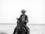 Actor James Dean Clad in Western Garb for His Role, Riding Horse on Location for the Movie "Giant" Premium Photographic Print by Allan Grant