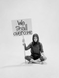 Writer Gloria Steinem Sitting on Floor with Sign "We Shall Overcome" Regarding Pop Culture, Photographic Print