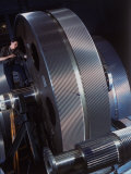 Man Dwarfed by Gigantic Gears He is Working on for the Navy, at General Electric Plant in US Photographic Print by Dmitri Kessel