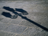Lamp-Post Shadow Near Harbour of Porta a Mare, Alghero, Sardinia, Italy Photographic Print by Martin Lladó