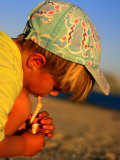 Boy Playing with Shells, Baja, Mexico Photographic Print by Philip & Karen Smith