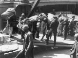 Taking on the Mail Port Said Egypt Photographic Print by Pontin Brown
