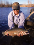 Portrait of a Flyfisherman Holding His Catch Photographic Print by Larry Stanley