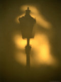 Shadow of Street Lamp on Wall in Mala Strana, Prague, Czech Republic Photographic Print by Richard Nebesky