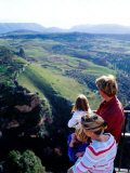 Family Looking at Countryside from Lookout, Ronda, Spain Photographic Print by Philip & Karen Smith
