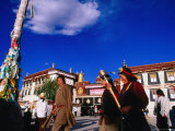 Tibetans Walking Around Jokhang Temple Spinning Prayer Wheels in Barkhor Square, Lhasa, China Photographic Print by Anthony Plummer
