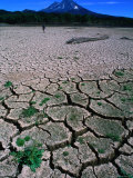Eroded Landscape with Volcano in Background, Conguillio National Park, Chile Photographic Print by Aaron McCoy