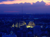 Wat Pho Lit Up at Night and City Buildings, Bangkok, Thailand Photographic Print by Tom Cockrem