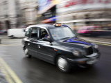 London Cab Traveling Through Traffic on a Rainy Day, England, London Photographic Print by Eightfish 