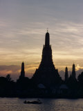 Silhouetted Men Row Boat Below the Temple of Dawn at Twilight Photographic Print by W. Robert Moore