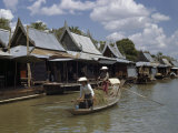 Women Paddle Sampan Along Canal Past Floating Shops and Houses Photographic Print by W. Robert Moore