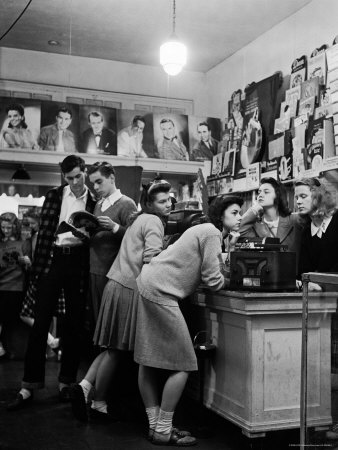 Teenagers Listening to 45 Rpm. Records as They Shop For the Latest Hits at a Record Store Photographic Print